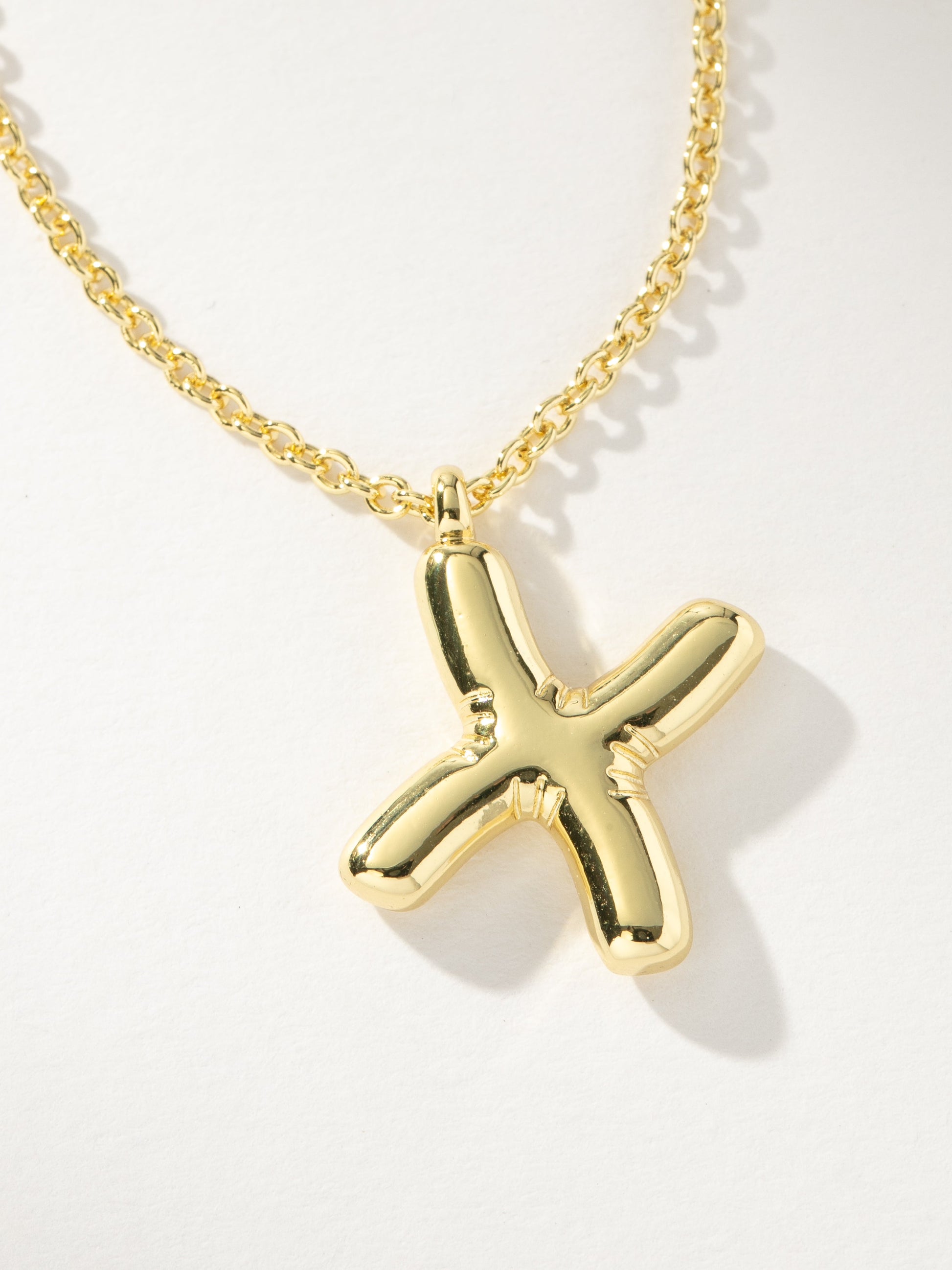 Bubble Letter Necklace | Gold X | Product Image | Uncommon James