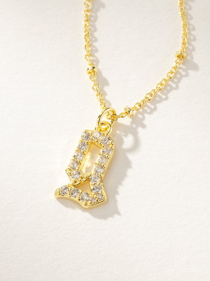 ["Made to Shine Initial Necklace ", " Gold ", " Product Image ", " Uncommon James"]