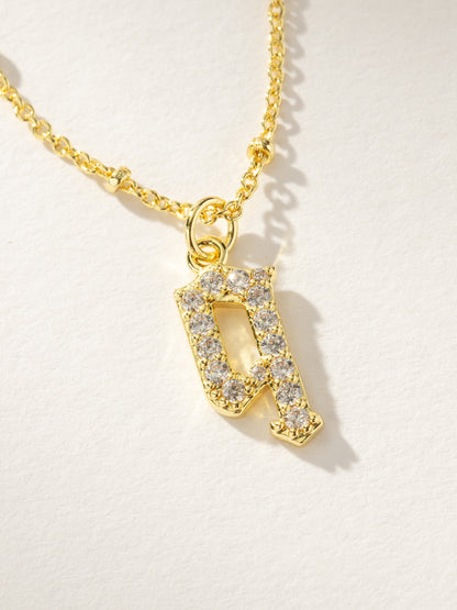 ["Made to Shine Initial Necklace ", " Gold ", " Product Image ", " Uncommon James"]