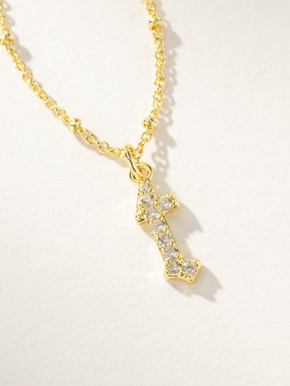 ["Made to Shine Initial Necklace ", " Gold ", " Product Image ", " Uncommon James"]