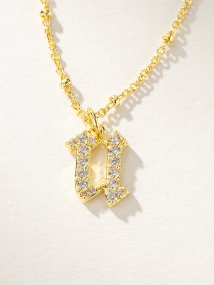 ["Made to Shine Initial Necklace ", " Gold ", " Product Image ", " Uncommon James"]