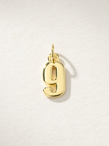 ["Star Player Charm ", " Gold 9 ", " Product Image ", " Uncommon James"]
