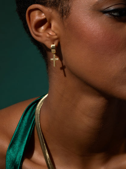 ["Bold Cross Huggie Earrings ", " Gold ", " Campaign Image ", " Uncommon James"]