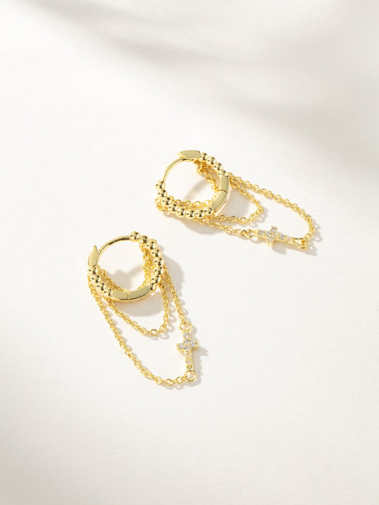 Cross and Chain Huggie Earrings | Gold | Model Image | Uncommon James