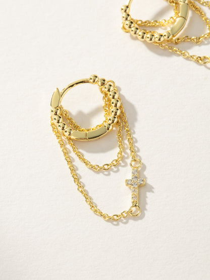 ["Cross and Chain Huggie Earrings ", " Gold ", " Product Image ", " Uncommon James"]