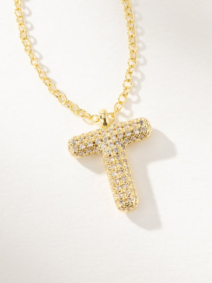 ["Bubble Letter Necklace 2.0 ", " Gold T ", " Product Image ", " Uncommon James"]