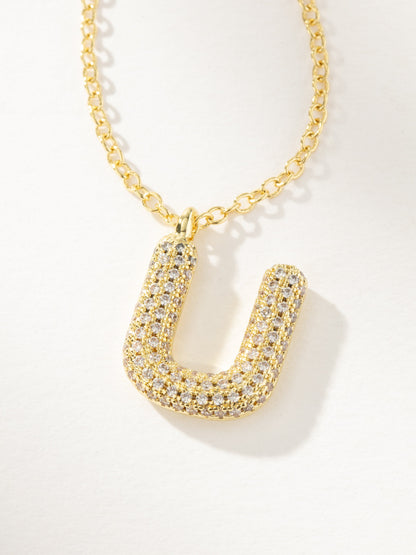 ["Bubble Letter Necklace 2.0 ", " Gold U ", " Product Image ", " Uncommon James"]