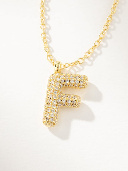 ["Bubble Letter Necklace 2.0 ", " Gold F ", " Product Image ", " Uncommon James"]