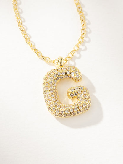 ["Bubble Letter Necklace 2.0 ", " Gold G ", " Product Image ", " Uncommon James"]
