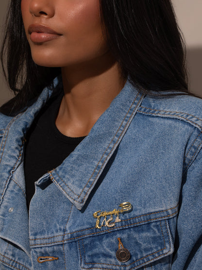 ["UJ x Rustler Howdy Pin ", " Gold ", " Model Image ", " Uncommon James"]