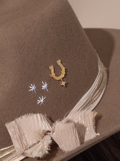 ["UJ x Rustler Horseshoe Push Pin ", " Gold ", " Modern Image ", " Uncommon James"]