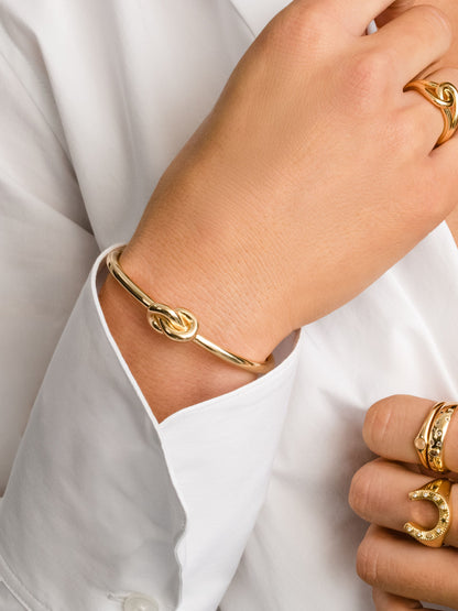["Forever Knot Cuff Bracelet ", " Gold ", " Model Image ", " Uncommon James"]