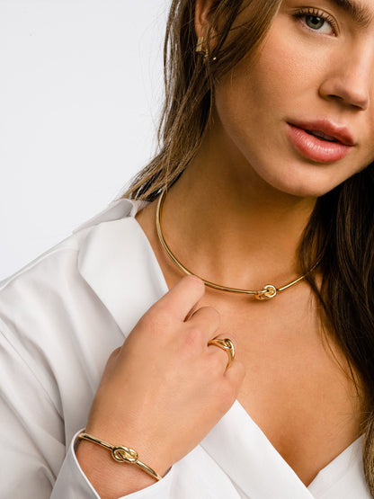 ["Forever Knot Cuff Bracelet ", " Gold ", " Model Image ", " Uncommon James"]
