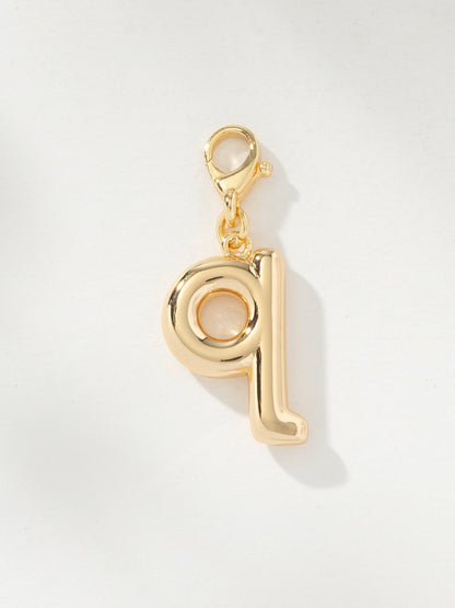 ["Bubble Letter Charm ", " Gold Q ", " Product Image ", " Uncommon James"]