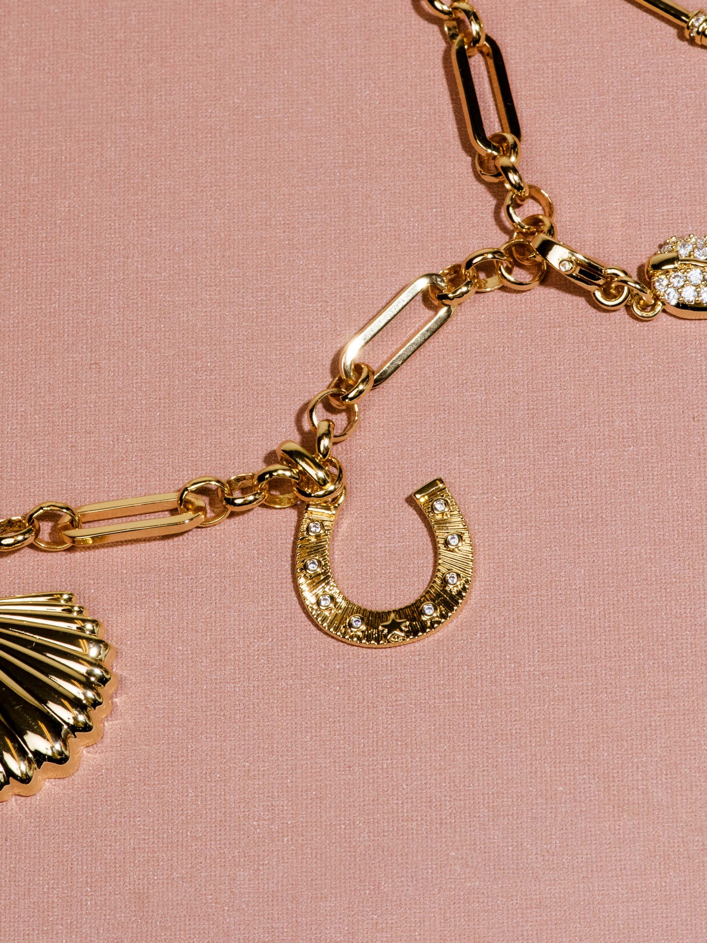 Horseshoe Charm | Gold | Flatlay Image | Uncommon James
