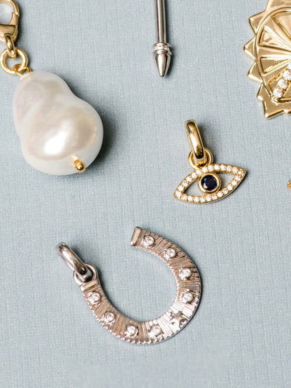 ["Horseshoe Charm ", " Silver ", " Flatlay Image ", " Uncommon James"]