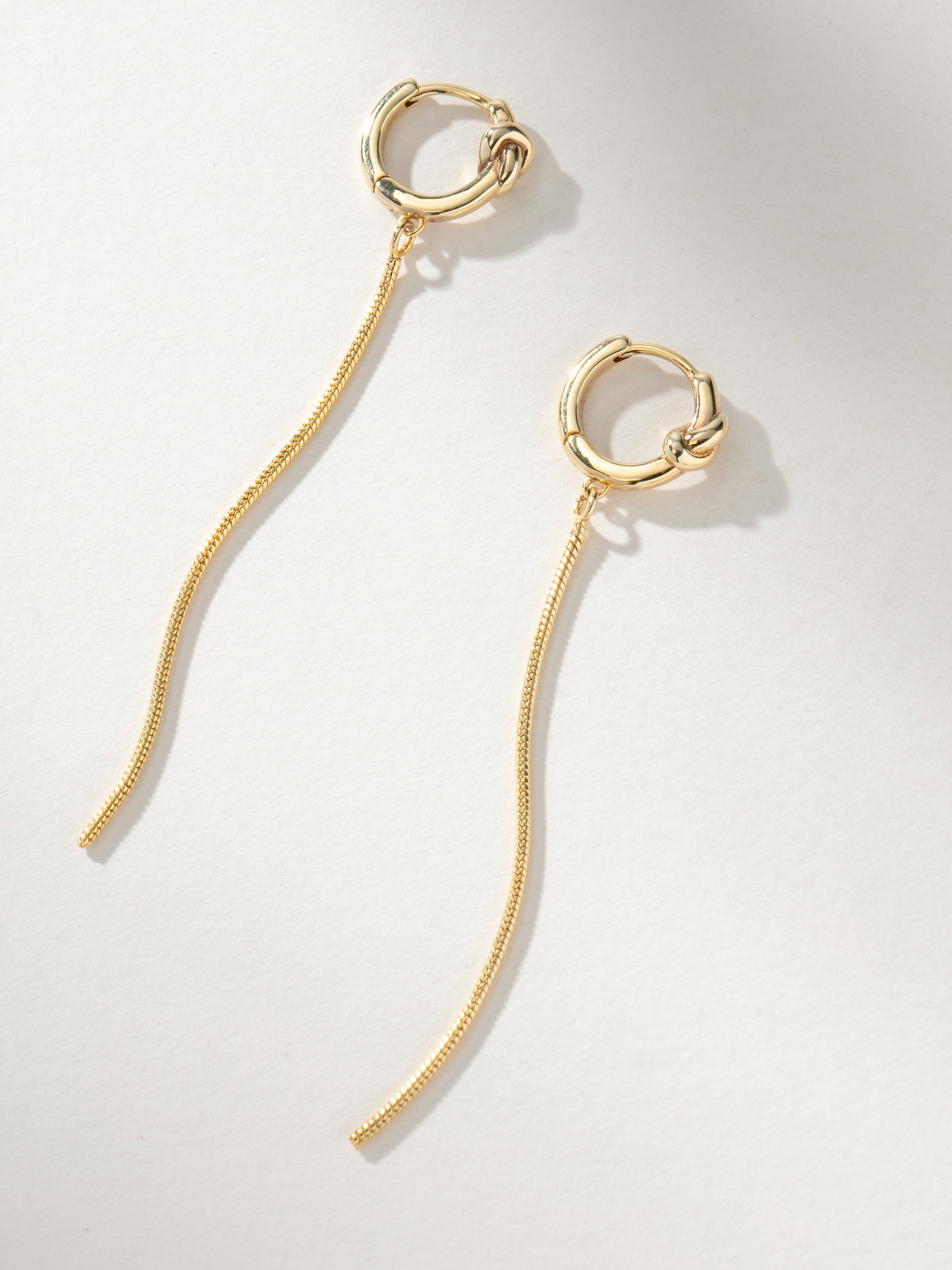 Forever Knot and Chain Huggie Earrings | Gold | Product Image | Uncommon James