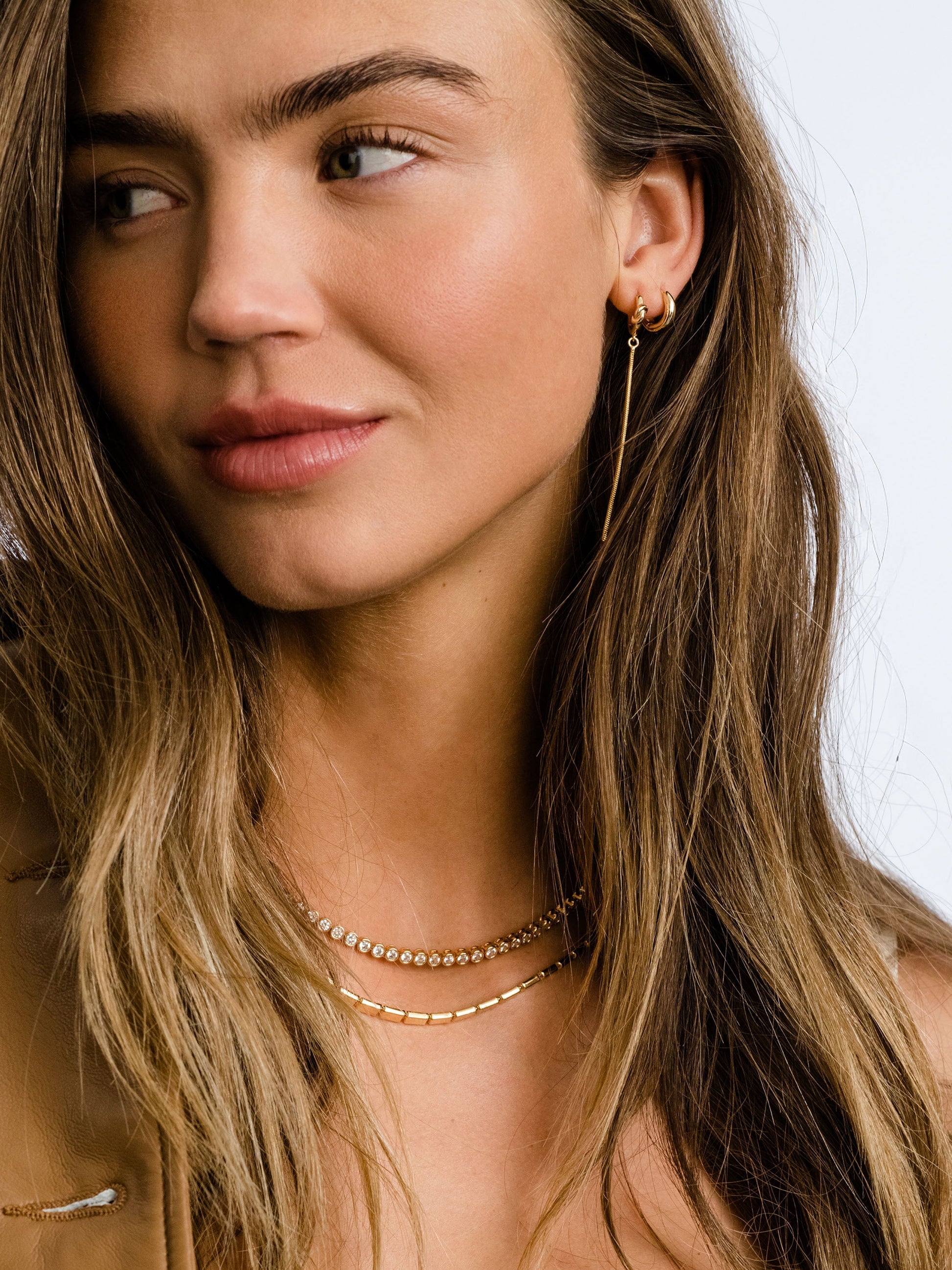 Forever Knot and Chain Huggie Earrings | Gold | Campaign Image | Uncommon James