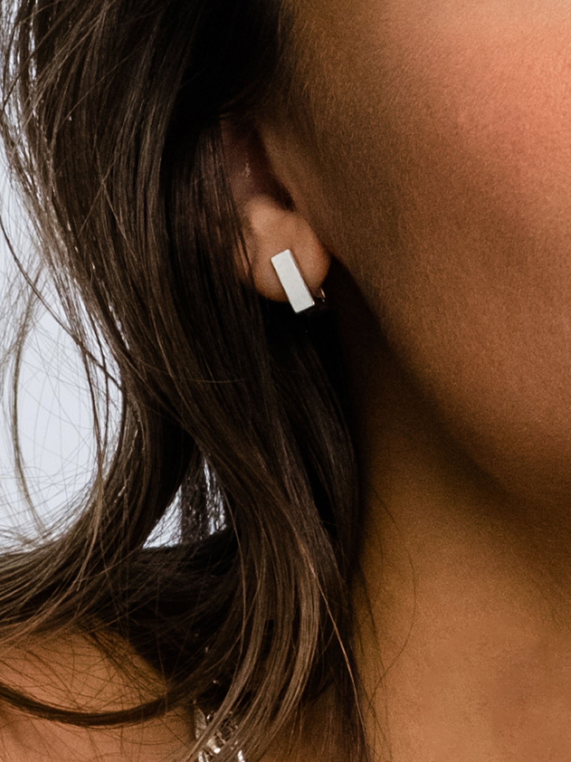 Passion Square Huggie Earrings | Silver | Model Image | Uncommon James