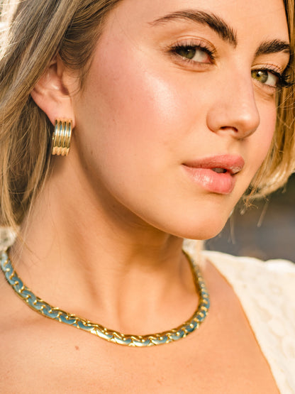 ["Eden Statement Chain Necklace ", " Gold ", " Campaign Image ", " Uncommon James"]