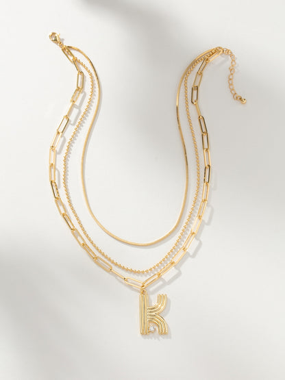 ["Muse Initial Layered Necklace ", " Gold ", " Product Image ", " Uncommon James"]
