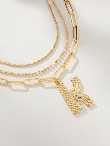 ["Muse Initial Layered Necklace ", " Gold ", " Product Image ", " Uncommon James"]