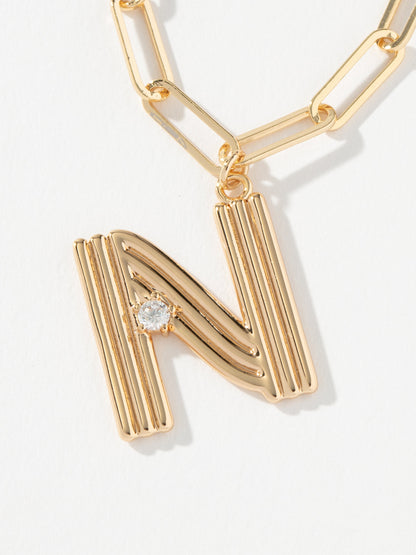["Muse Initial Layered Necklace ", " Gold N ", " Product Image ", " Uncommon James"]