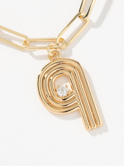 ["Muse Initial Layered Necklace ", " Gold Q ", " Product Image ", " Uncommon James"]