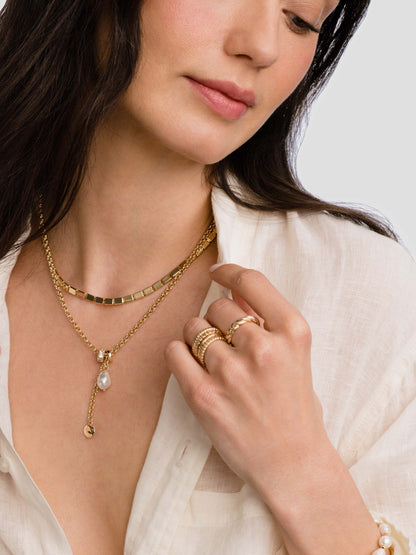 ["Tide Twist Ring ", " Gold ", " Model Image ", " Uncommon James"]