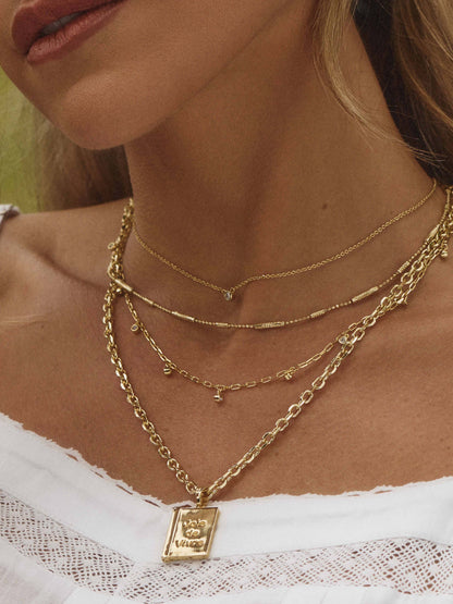 ["Daydreaming Chain Necklace Stack ", " Gold ", " Kristin Image ", " Uncommon James"]