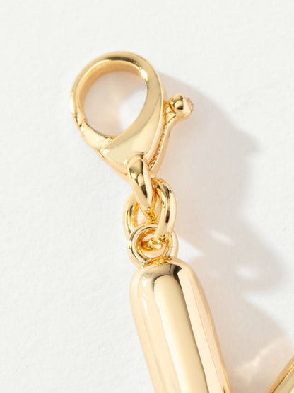 ["Arrow Charm ", " Gold ", " Product Image ", " Uncommon James"]